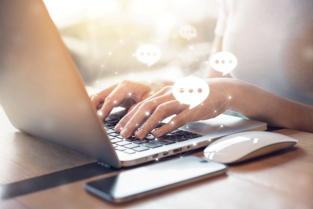 woman typing on laptop