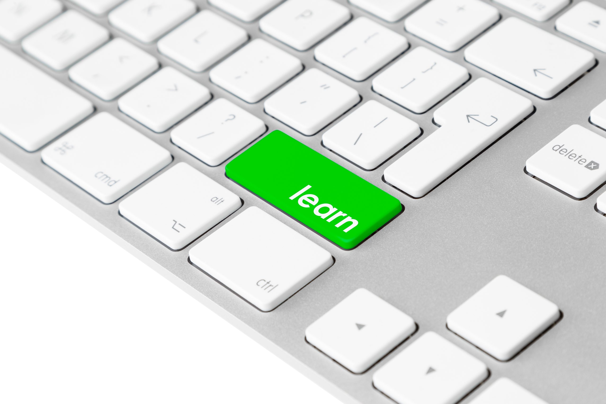 keyboard with green "learn" key