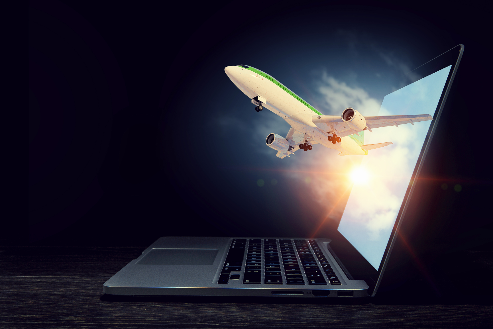 plane flying out of laptop